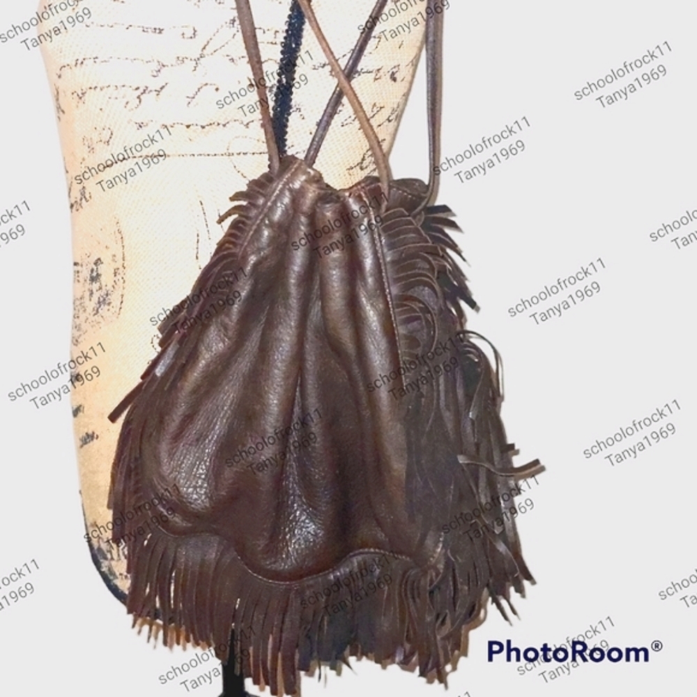 Vintage leather cinch bag with fringed trim